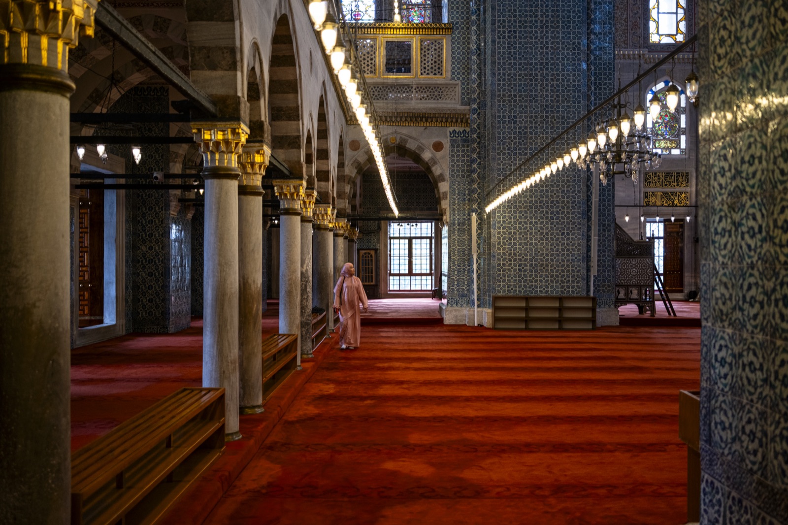 Inside a great mosque: red carpet, columns and light