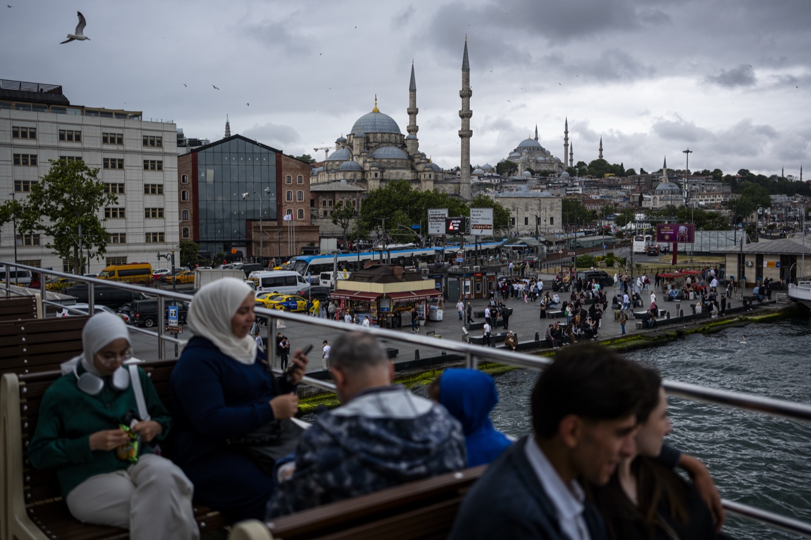 Passengers on a Bosphorus ferry with the historic peninsula skyline behind