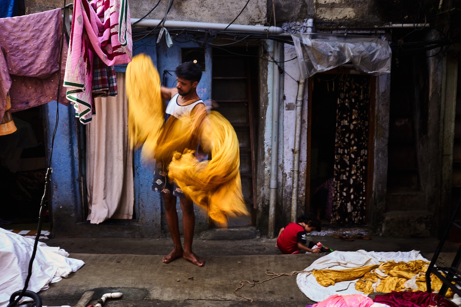 Dyed fabric being worked in Dharavi, Mumbai