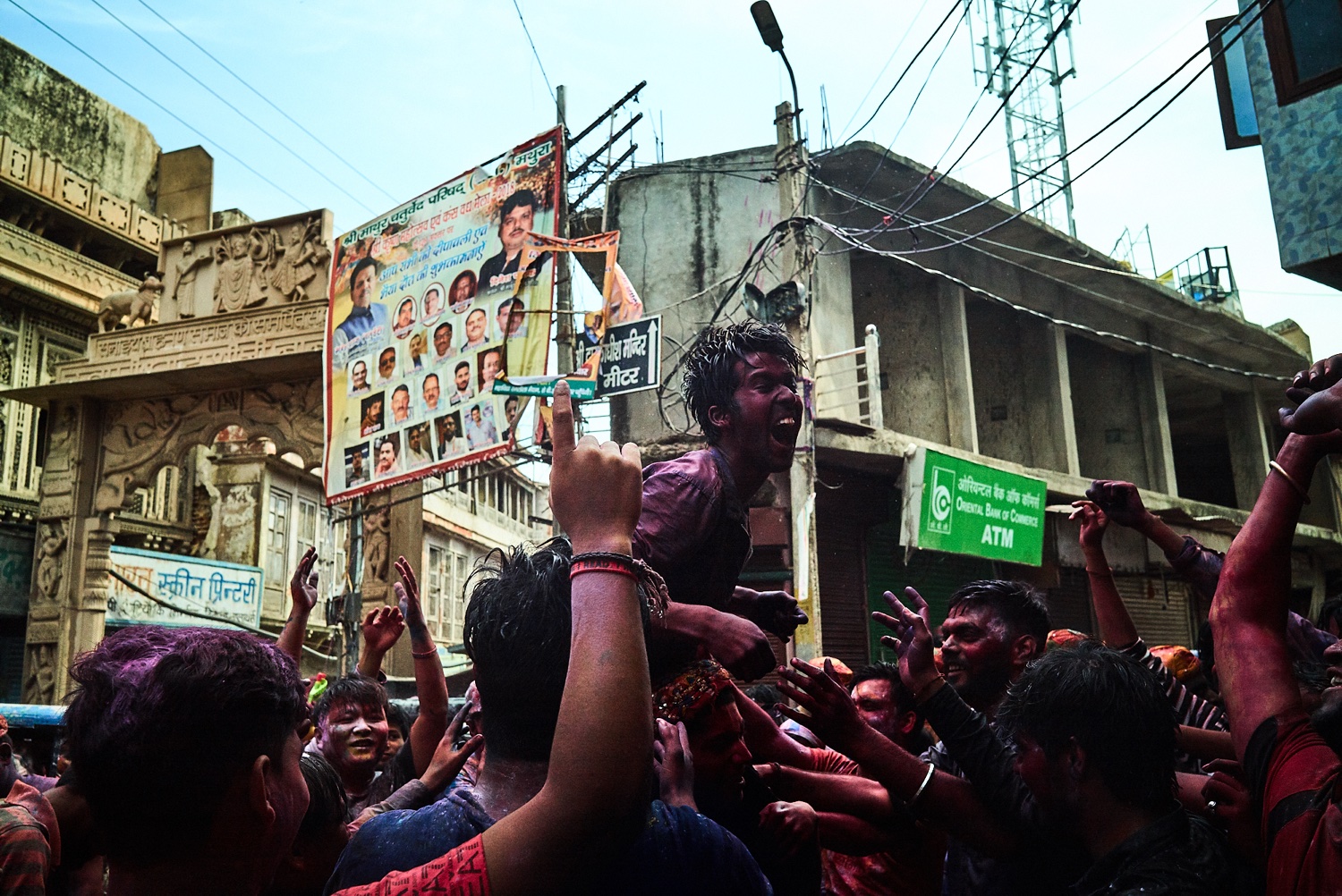 Man carried above the crowd during Holi celebrations